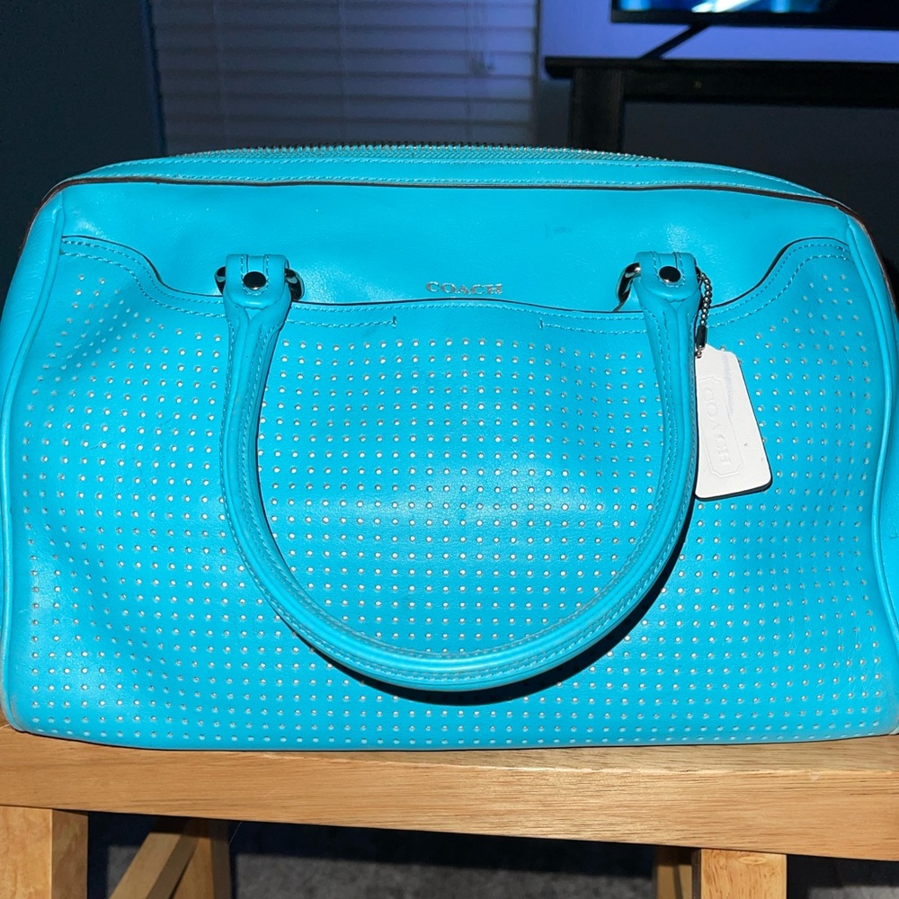 Blue Coach tote handbag.